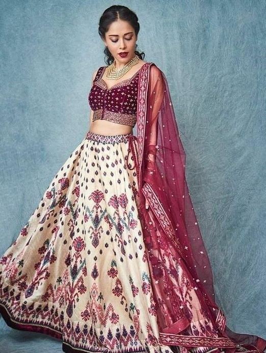 image of white color lehenga with maroon